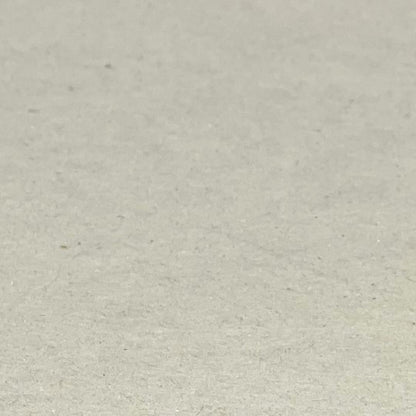 Close up showing the grey colour of a sheet of greyboard